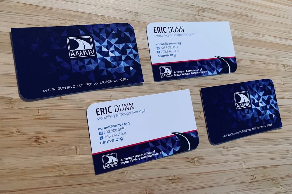 Three business cards with a blue and white design